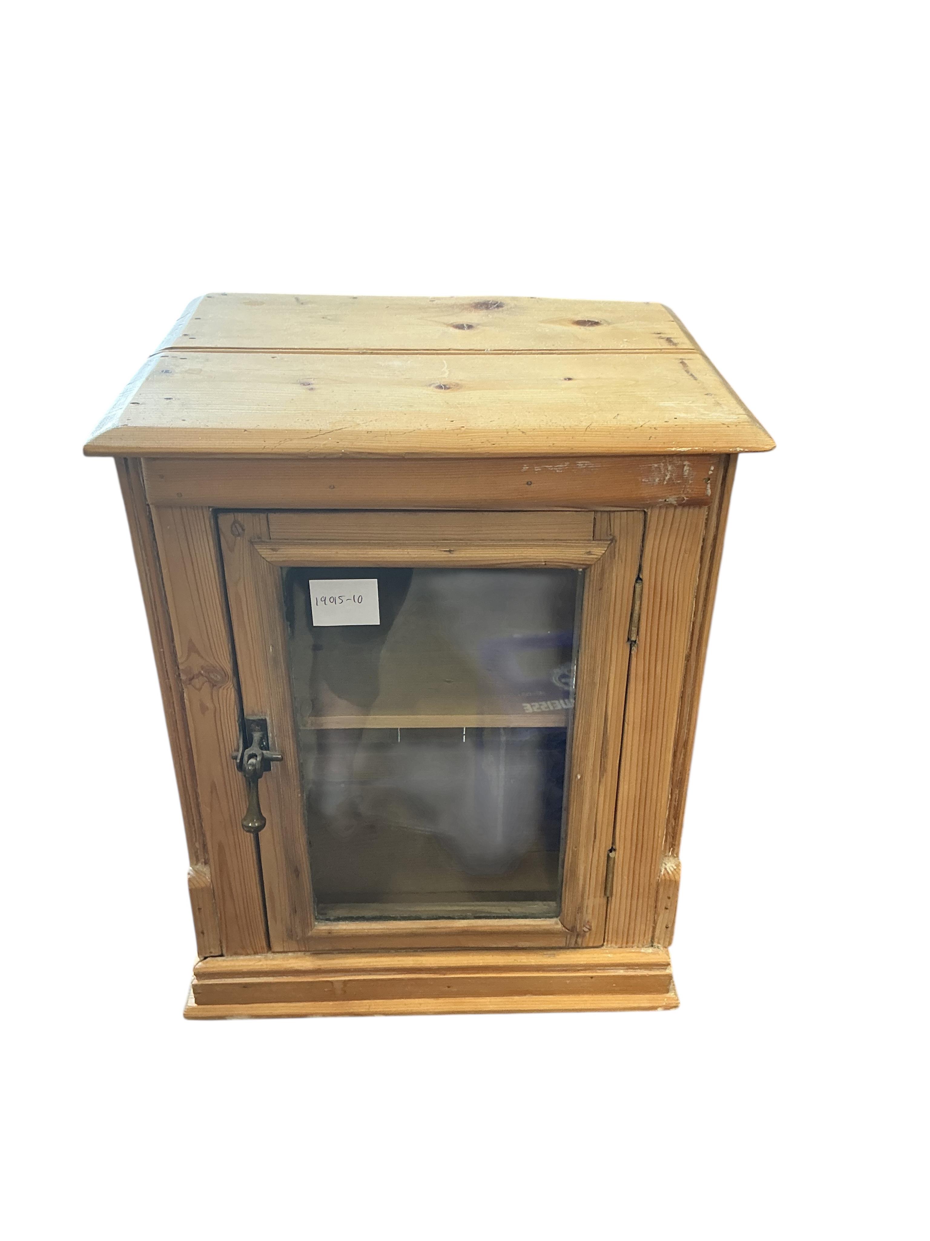 A small 19th century glazed pine table top cabinet, width 37cm, depth 29cm, height 46cm